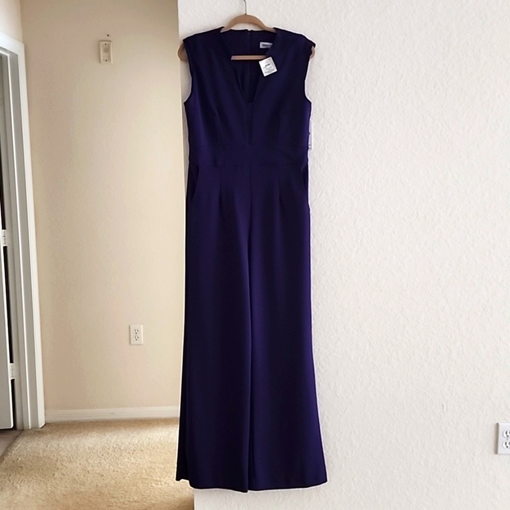 A woman's purple jumpsuit absolute in size eight.